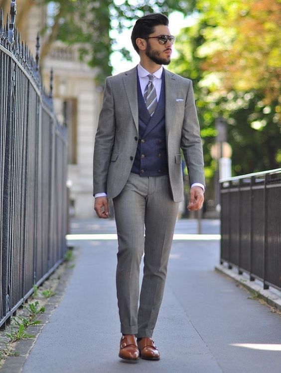 Grey Suit + Navy Self Printed Waist Coat + White Shirt + Tan Double Monks Shoes